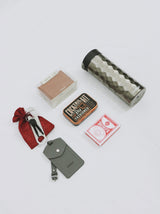 Personalized gift box for men with tech kit, old fashioned cocktail kit, playing cards, coffee tumbler, bottle opener, luggage tag, and unique keys as tools.