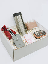 Personalized gift box for men with tech kit, old fashioned cocktail kit, playing cards, coffee tumbler, bottle opener, luggage tag, and unique keys as tools.