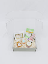 Premade gift box for girl, includes multiple candies from Sugarfina, Face Masque, Hair Masque, candle, champagne sugar cubes and hand cream.