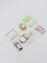 Premade gift box for girl, includes multiple candies from Sugarfina, Face Masque, Hair Masque, candle, champagne sugar cubes and hand cream.