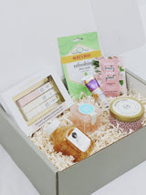 Premade gift box for girl, includes multiple candies from Sugarfina, Face Masque, Hair Masque, candle, champagne sugar cubes and hand cream.