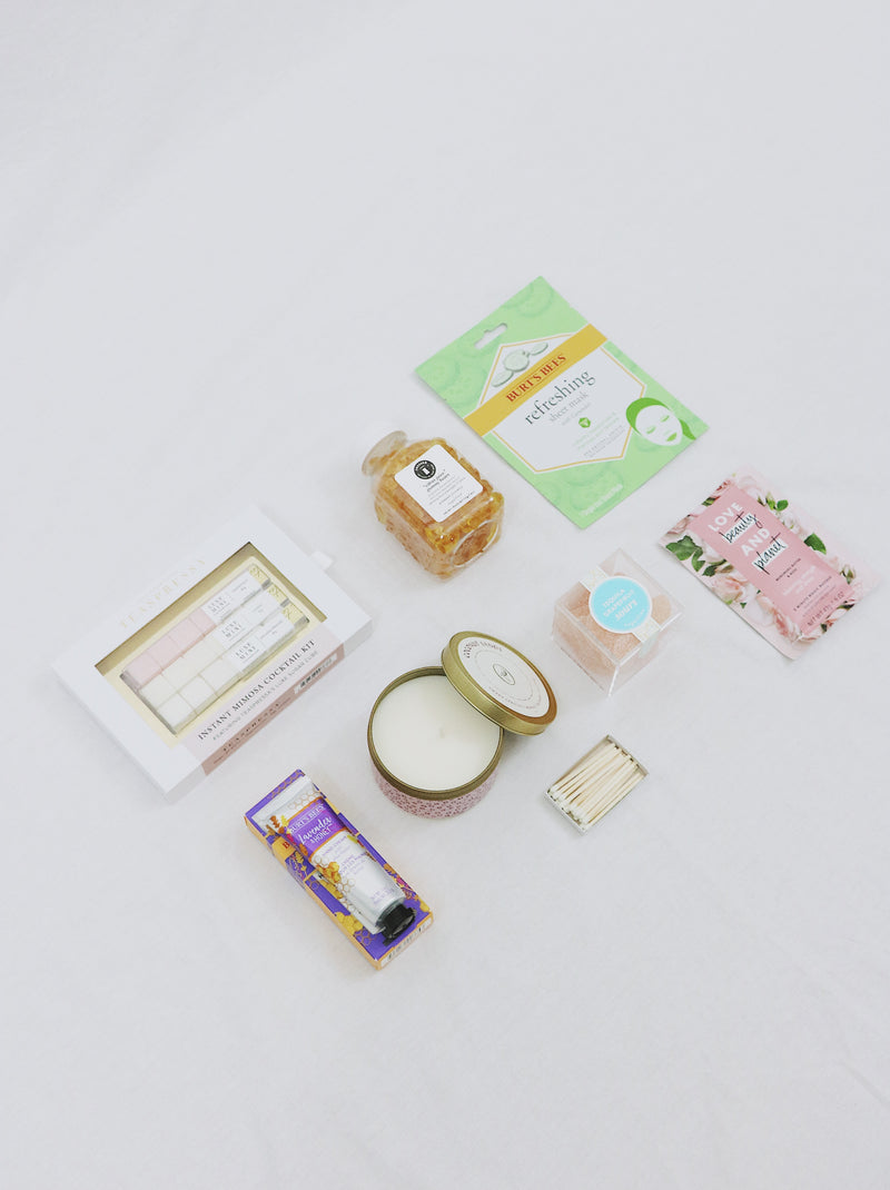 Premade gift box for girl, includes multiple candies from Sugarfina, Face Masque, Hair Masque, candle, champagne sugar cubes and hand cream.